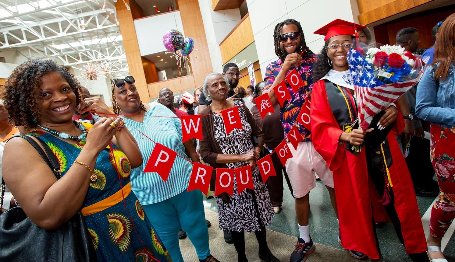 Student celebrates with their family at College Park Academy’s 2023 graduation ceremony